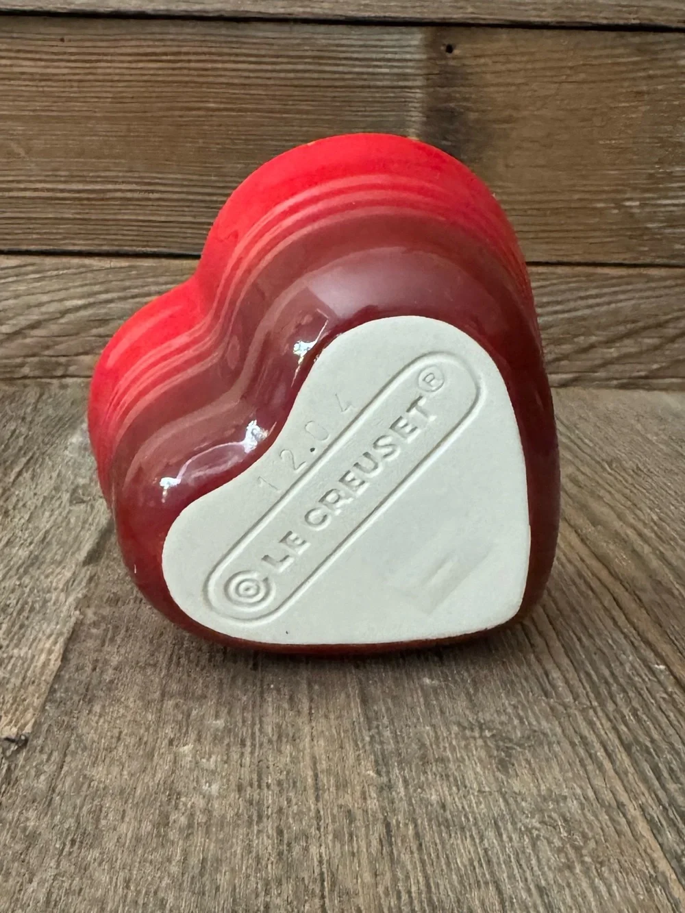 Red Le Creuset heart-shaped stoneware ramekin